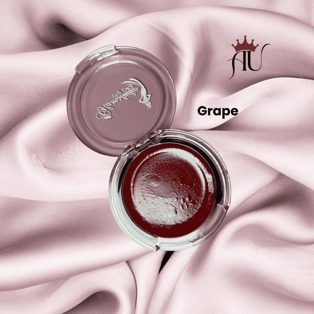 Grape Cream Blush deep berry tone in clear compact on pink satin fabric background