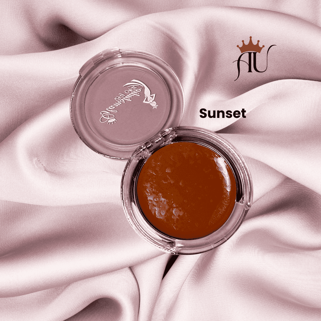 Sunset Cream Blush with golden warm-toned finish in clear compact on pink satin fabric